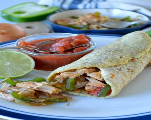 Soft corn tortillas with shredded chicken and cactus